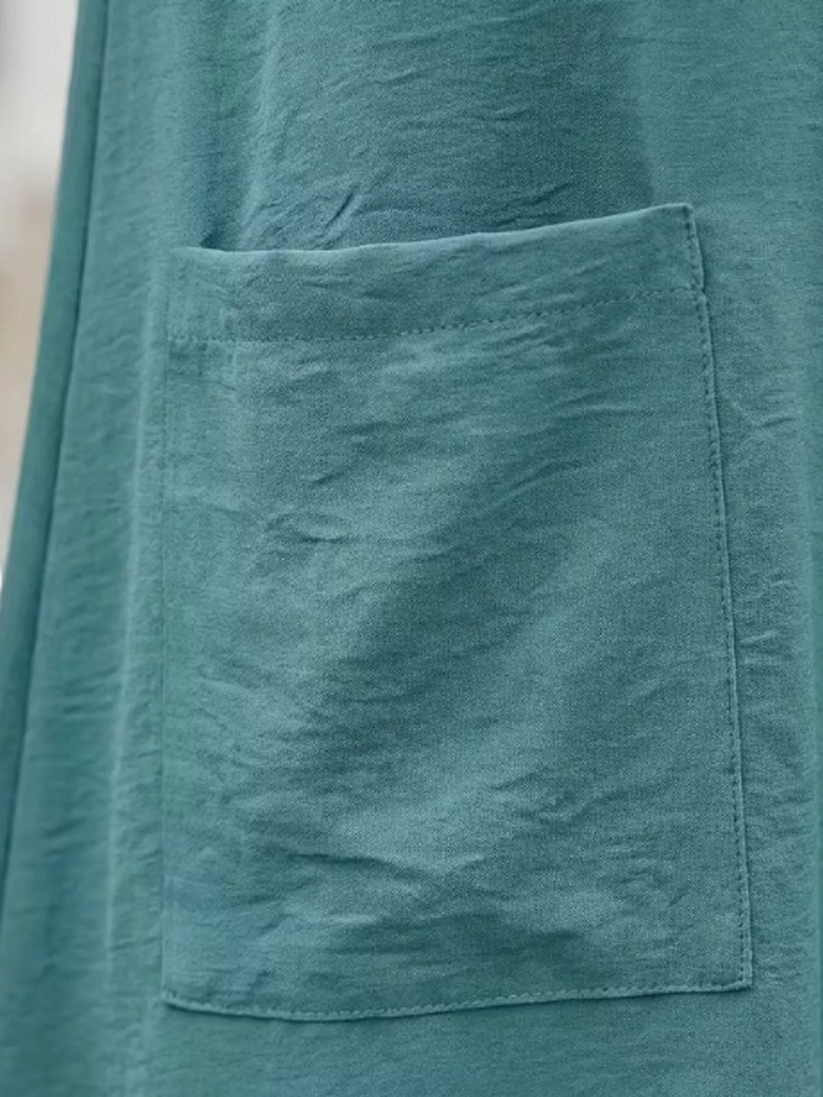 Loose fit T-shirt dress with pockets from Trendsi, featuring a casual, comfortable design and a relaxed silhouette.