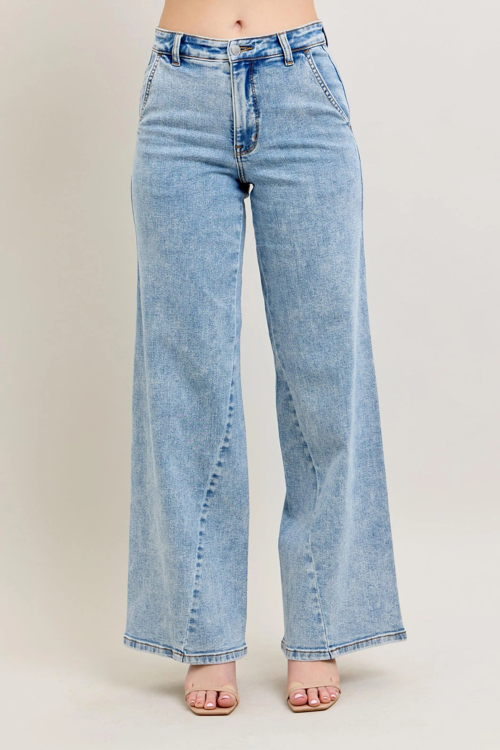 Plus size Judy Blue high waist wide leg jeans with skewed inseam, showcasing the stylish fit and design details.