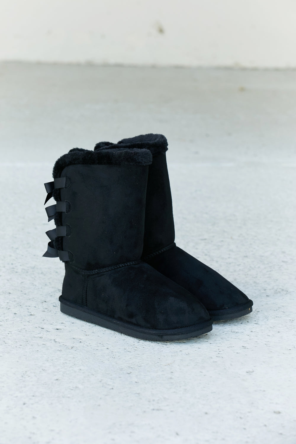 Trendsi Forever Link snow boots with bow detail, faux suede leather exterior, designed for winter warmth and stylish winter wear.
