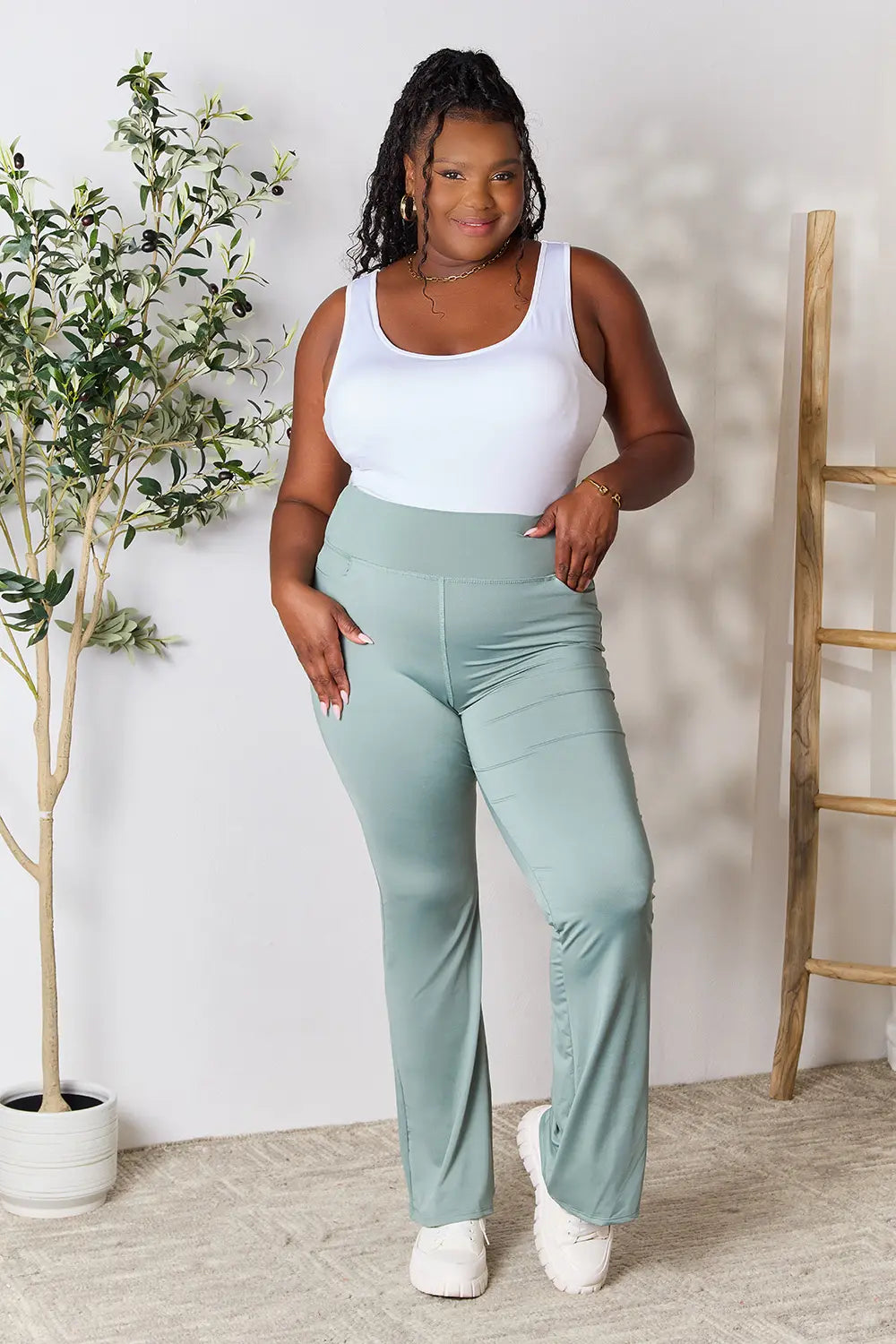 Heimish full size wide waistband sports pants in plus size, featuring a comfortable fit and stylish design, shown on a model.