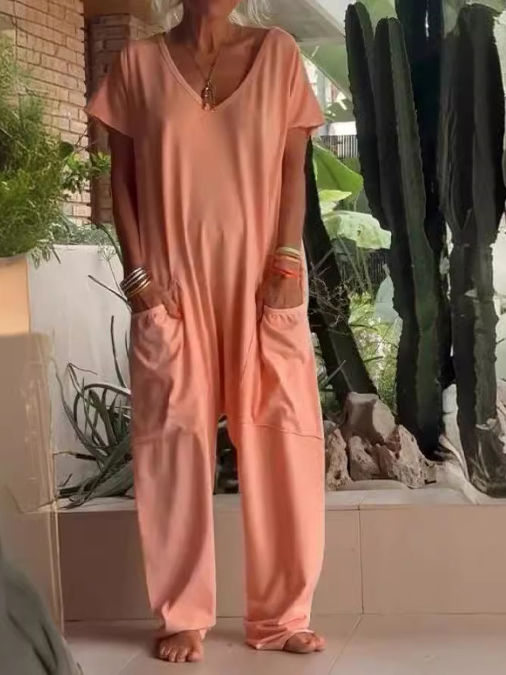 Plus size loose fit V-neck short sleeve wide leg jumpsuit by Trendsi, shown in a full-size image highlighting the relaxed fit and style.