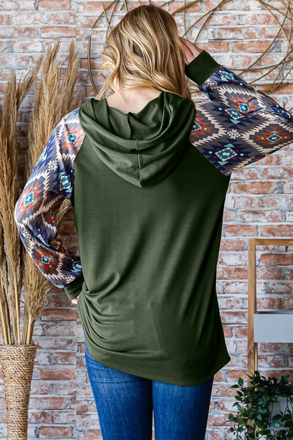 Heimish full-size half-button printed long sleeve hooded top, trendy casual shirt with a hood and button details, shown on a model.