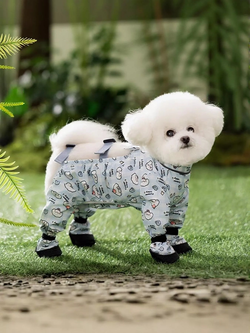 Cute cartoon print pet jumpsuit from Trendsi, featuring colorful animal designs and comfortable fabric for pets.