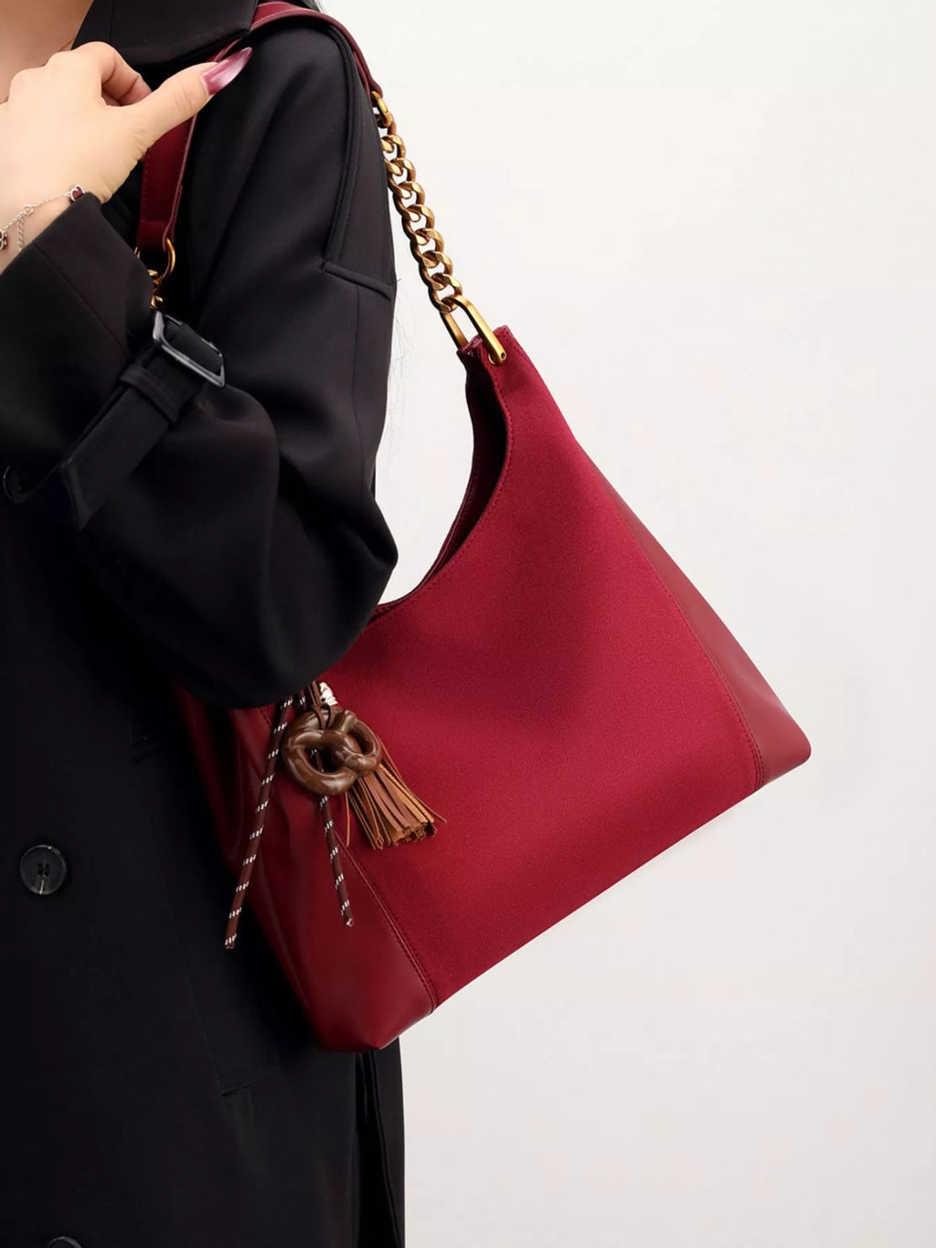 Trendsi Chain Strap Tassel Charm Shoulder Bag showing a black bag with a chain strap and decorative tassel detail.