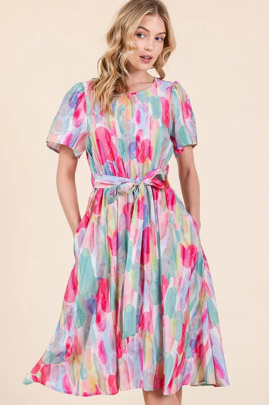 Lime 'N' Chili Watercolor Print Tie Front Midi Dress by Trendsi, featuring a vibrant watercolor pattern and a stylish tie front design.