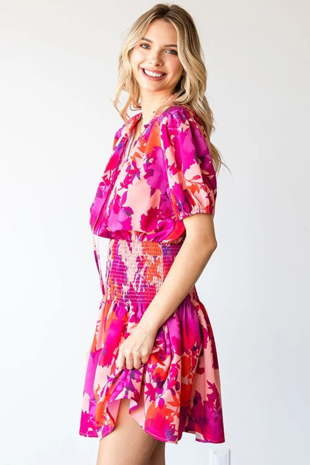 Trendsi First Love floral mini dress with short sleeves and smocked bodice, featuring a feminine, lightweight summer design.