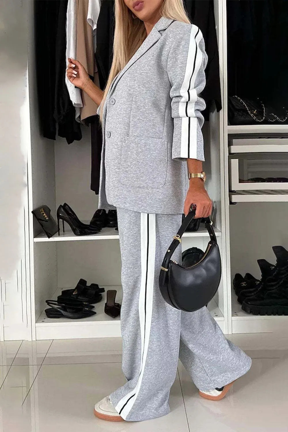 Full size contrast lapel collar top and pants set by Trendsi, featuring a stylish tailored design and modern contrast details.