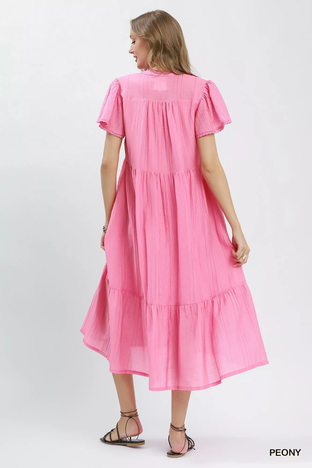 Umgee textured tiered midi dress with side pockets, featuring a flowing design and stylish details, perfect for casual wear.