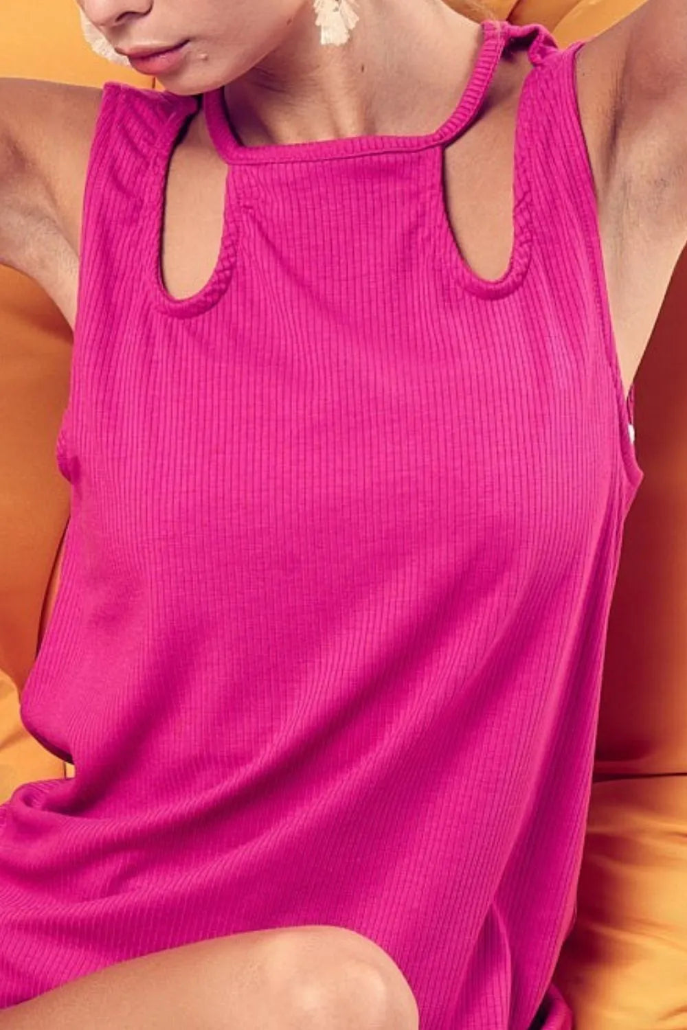 Trendsi BiBi rib knit shoulder cut-out detailed top featuring a fitted design and stylish cut-out shoulder accents.