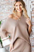 Trendsi First Love contrast V-neck ribbed knit top displayed on a mannequin, featuring a fitted design and textured fabric.