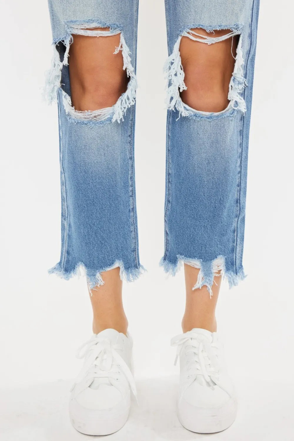 Kancan high waist chewed-up straight mom jeans by Trendsi, featuring distressed details and a classic fit on a model.