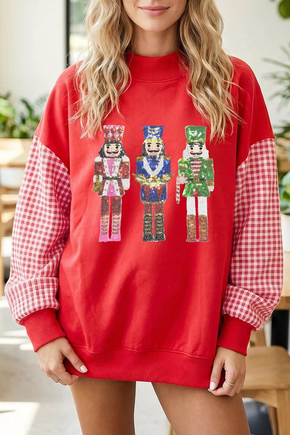 Deep red Christmas sweatshirt with sequin nutcracker