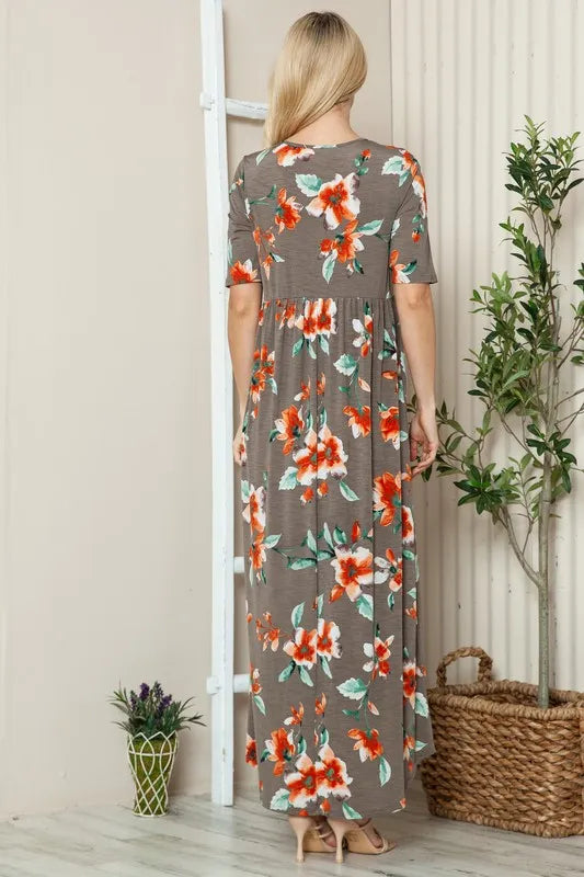 Floral round neck short sleeve maxi dress from BOMBOM by Trendsi, featuring a flowy silhouette and vibrant floral print.