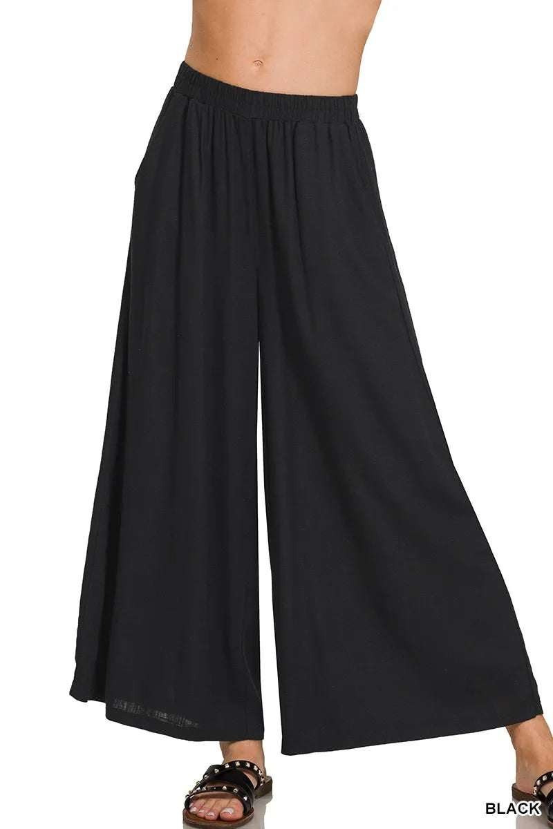 Woven pleated linen blend wide-leg pants from Zenana, shown in natural fabric with a relaxed fit and stylish pleats.