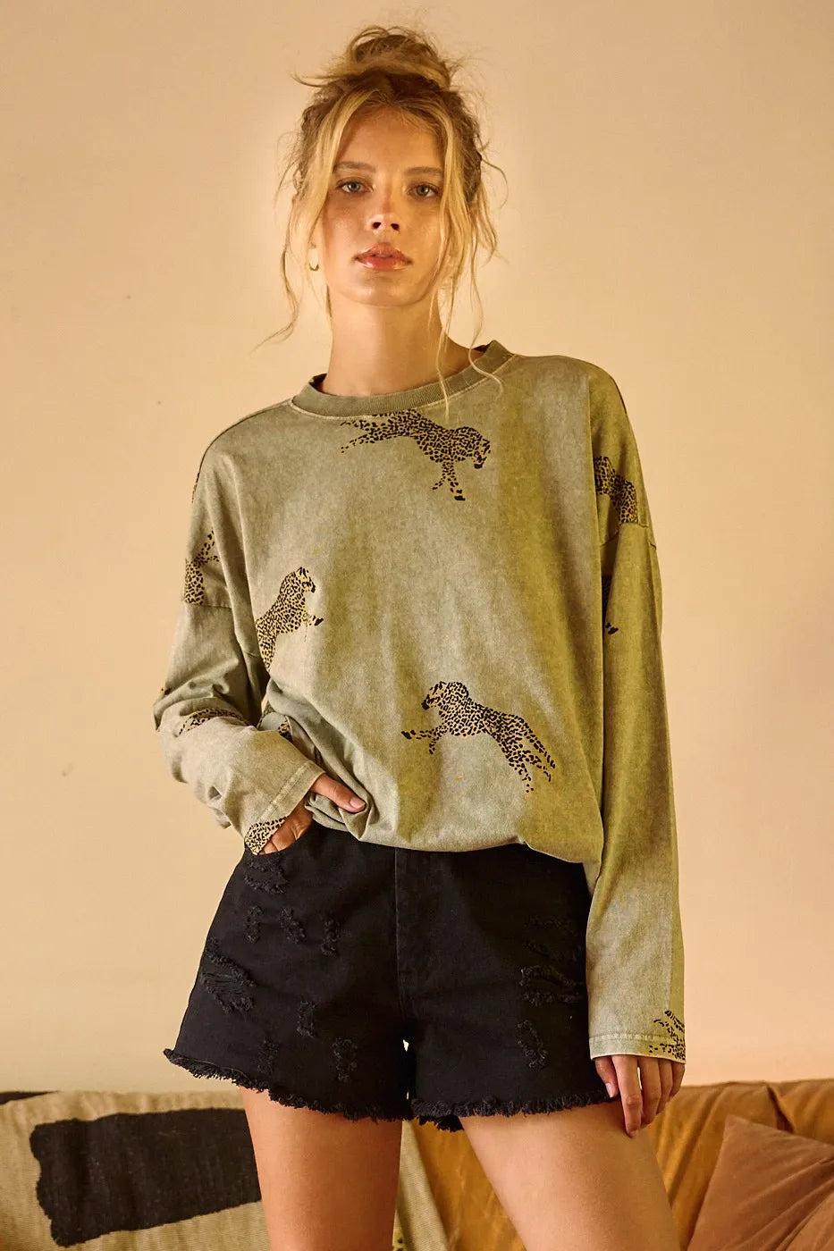 Long sleeve top by Trendsi featuring a mineral wash finish and a trendy cheetah print design.