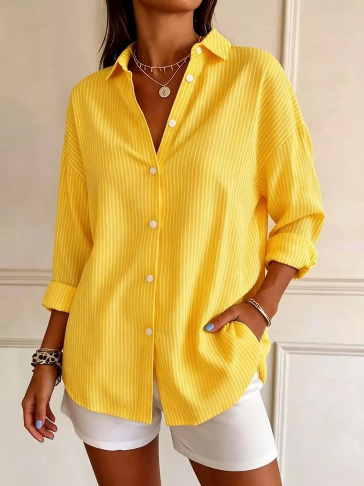 Plus size striped button-down long sleeve shirt by Trendsi, featuring a classic pattern and full-length sleeves, displayed on a white background.