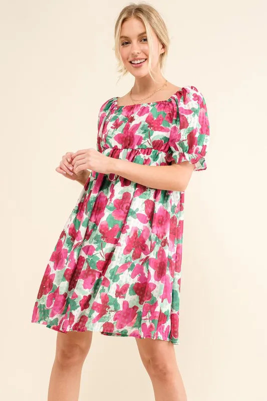 Smocked floral ruffle mini dress with short sleeves from Trendsi, featuring a feminine, boho-inspired design and lightweight fabric.