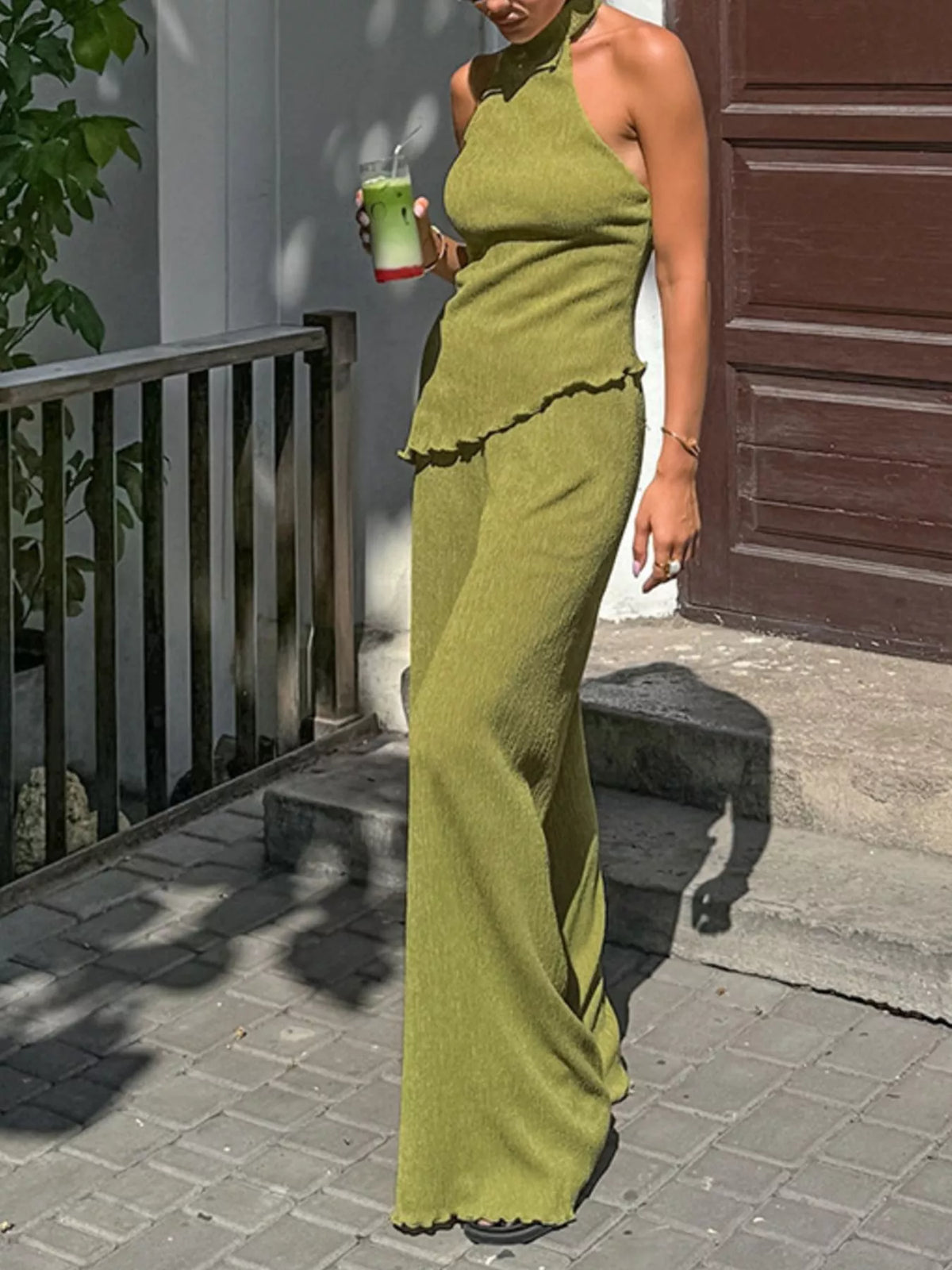 Trendsi sleeveless top and wide-leg pants two-piece set, featuring a stylish sleeveless blouse and flowy wide-leg trousers.