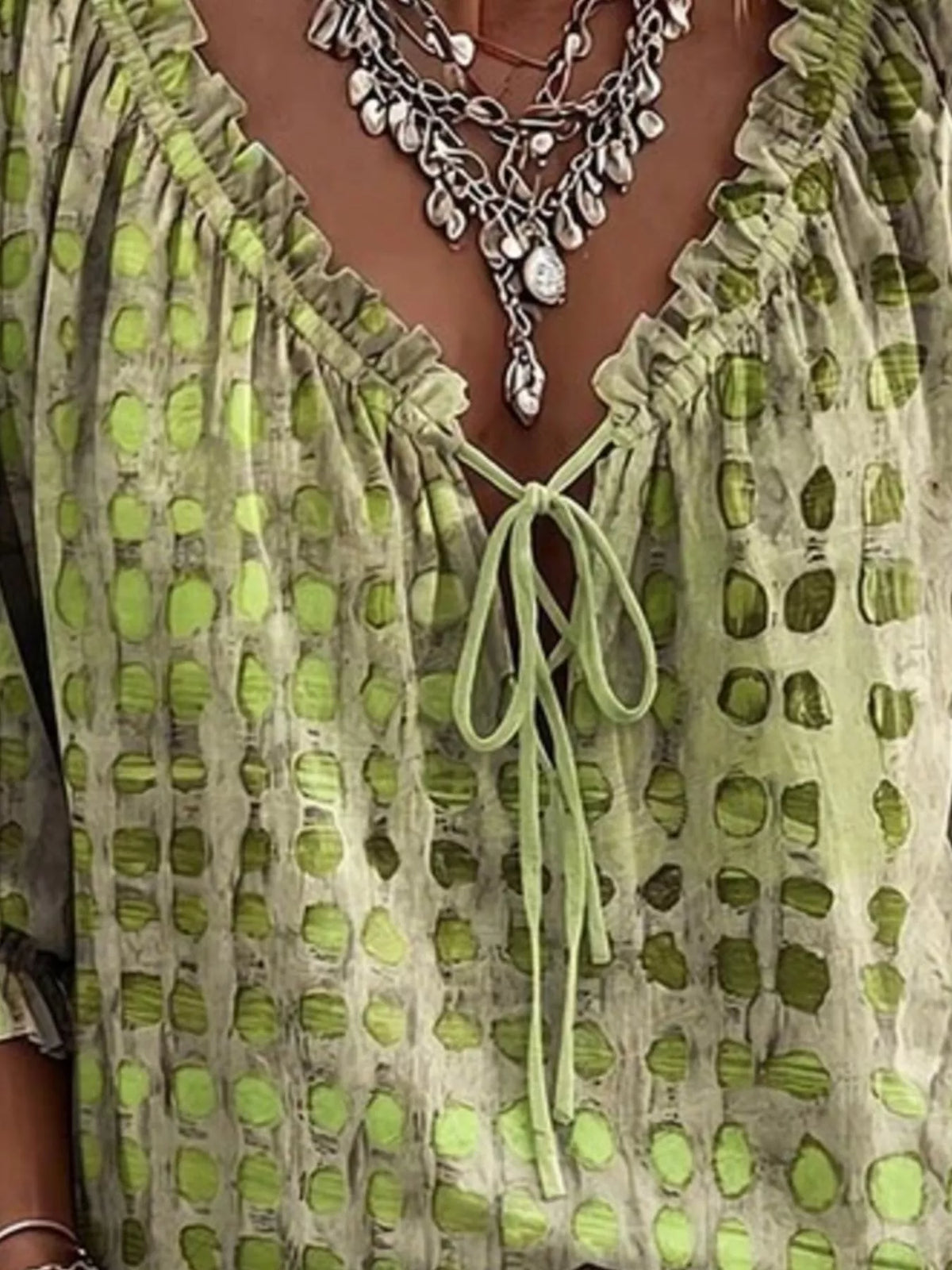 Plus size full size tie-neck blouse with 3/4 sleeves from Trendsi, featuring a stylish and comfortable fit.