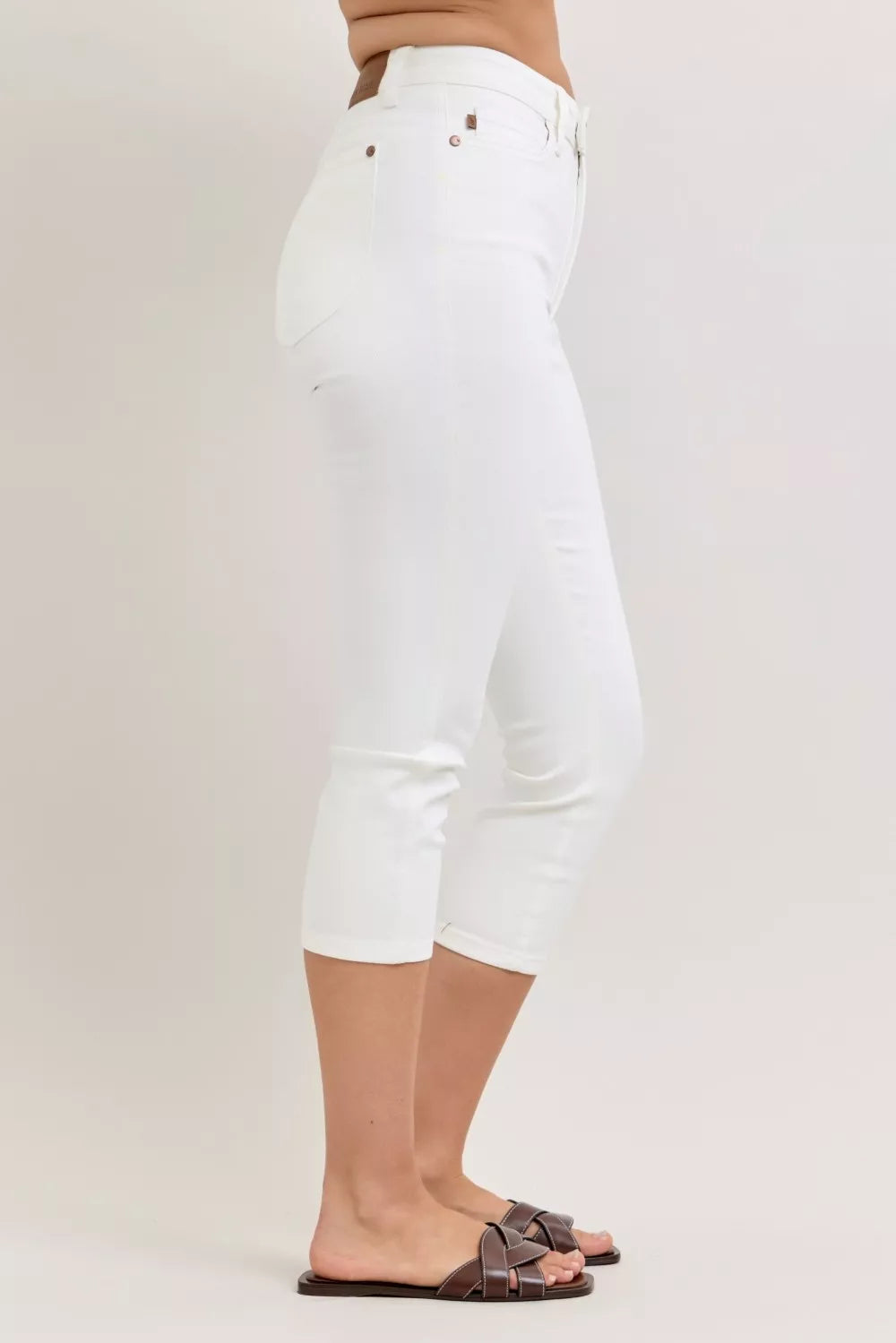 Trendy Judy Blue high waist capri pants with extended waistband and spade pockets, stylish and comfortable for casual wear.