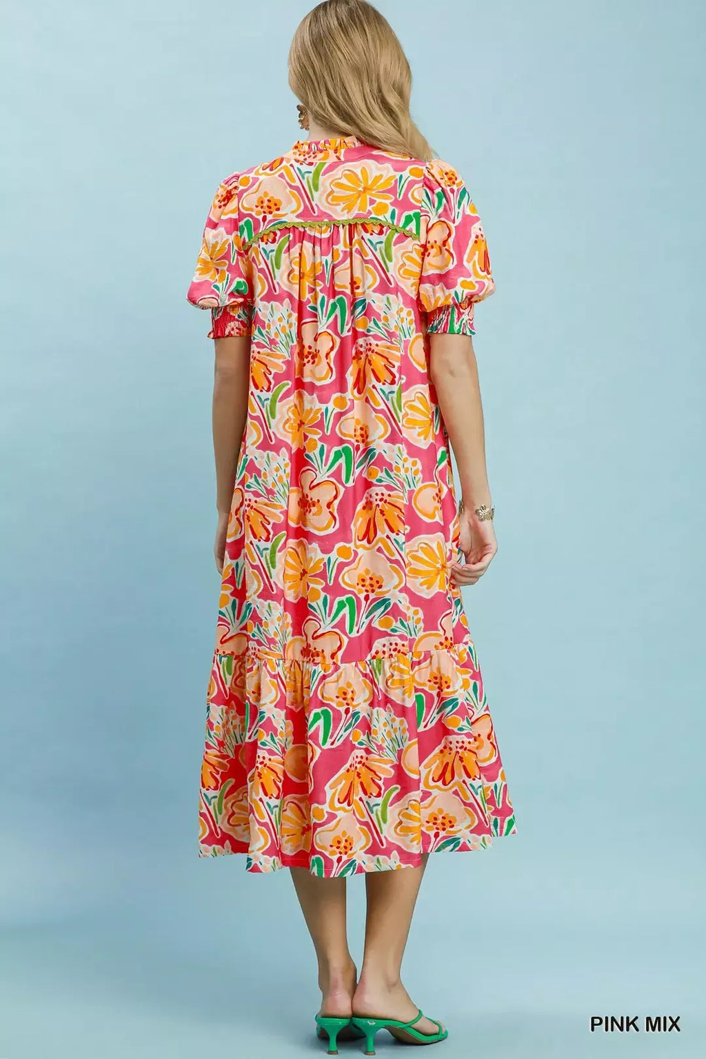 Umgee floral print puff sleeve tiered midi dress with a flowy silhouette and vibrant floral pattern.