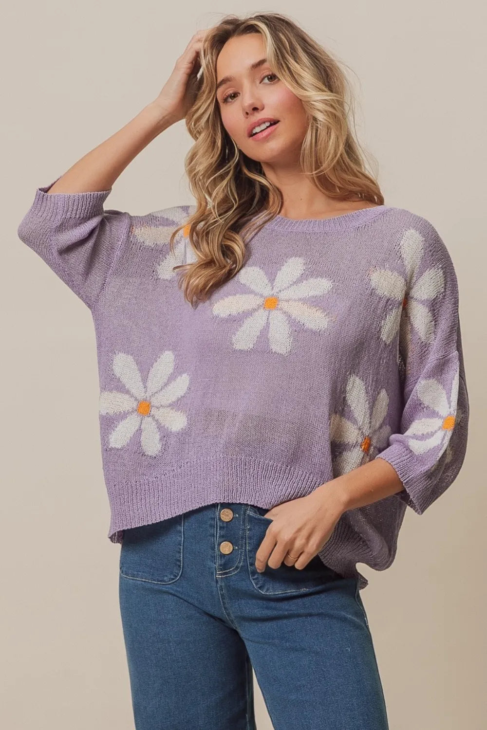 BiBi floral pattern slit sweater by Trendsi, featuring a stylish floral design and a side slit, made of soft knit fabric.
