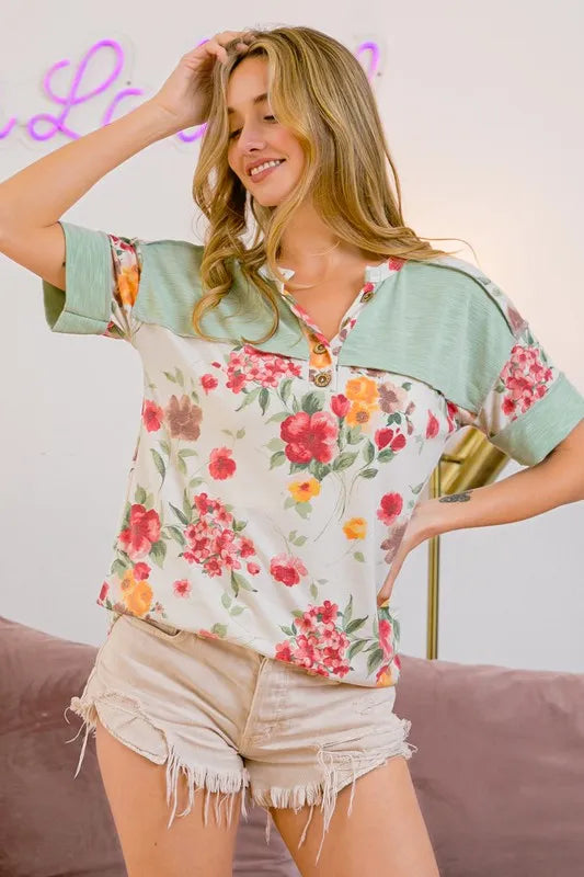 Trendsi BiBi floral button detail round neck short sleeve terry T-shirt showing floral pattern and button accents on a white fabric