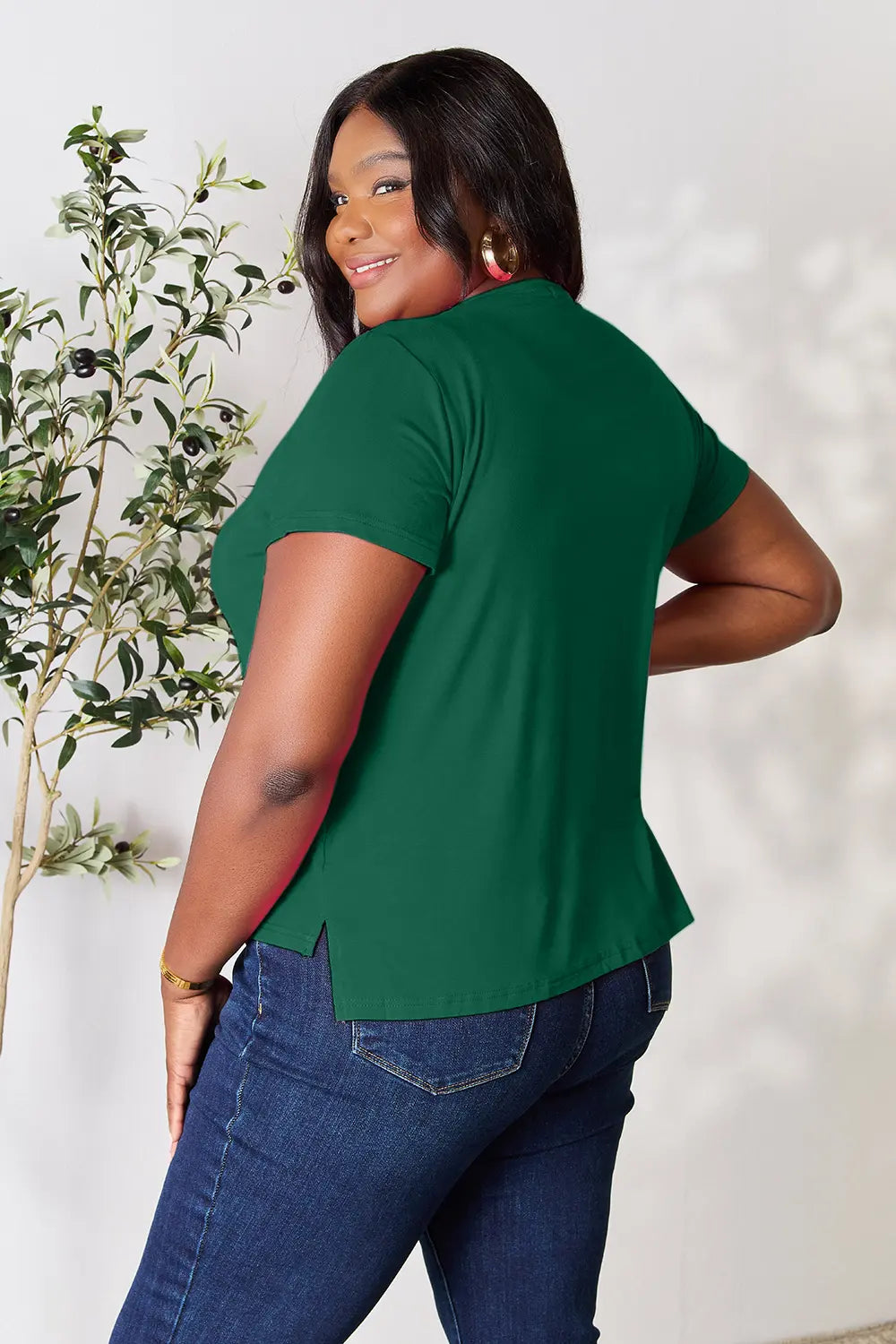 Plus size Basic Bae full size round neck short sleeve T-shirt by Trendsi, shown in a comfortable, casual fit with a classic crew neckline.