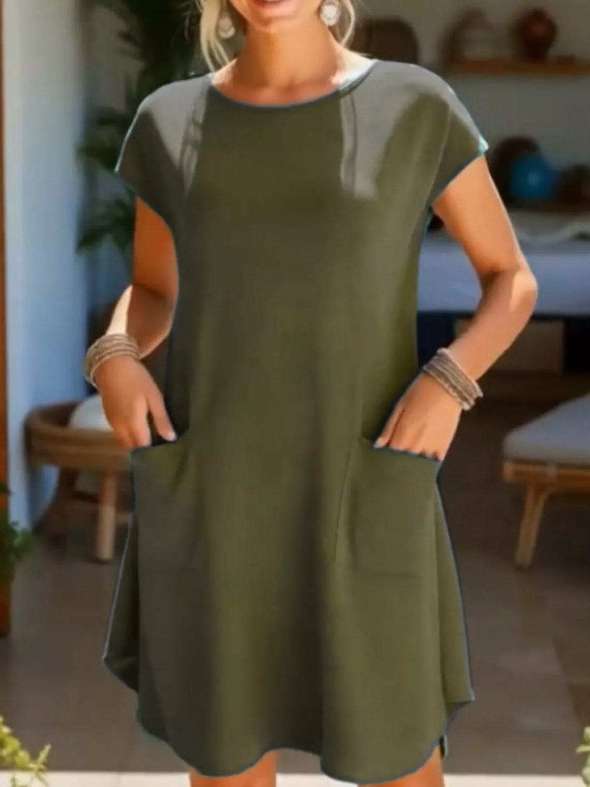 Loose fit T-shirt dress with pockets from Trendsi, shown in a casual style on a model with a relaxed fit and short sleeves.