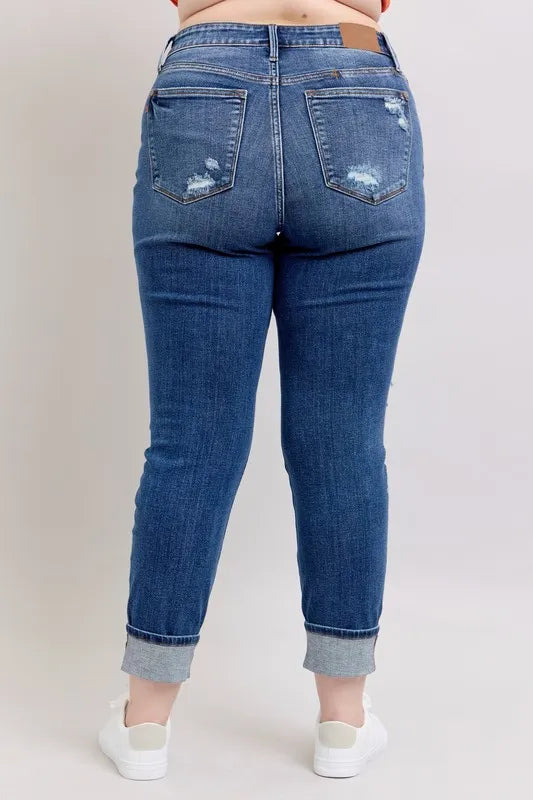 Trendsi Judy Blue plus size full-length boyfriend jeans with mid-rise, distressed details, yoke pockets, and faux selvedge cuff.