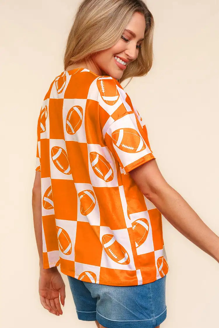 Haptics football checkered print short sleeve T-shirt by Trendsi, featuring a bold checkered pattern and casual fit.