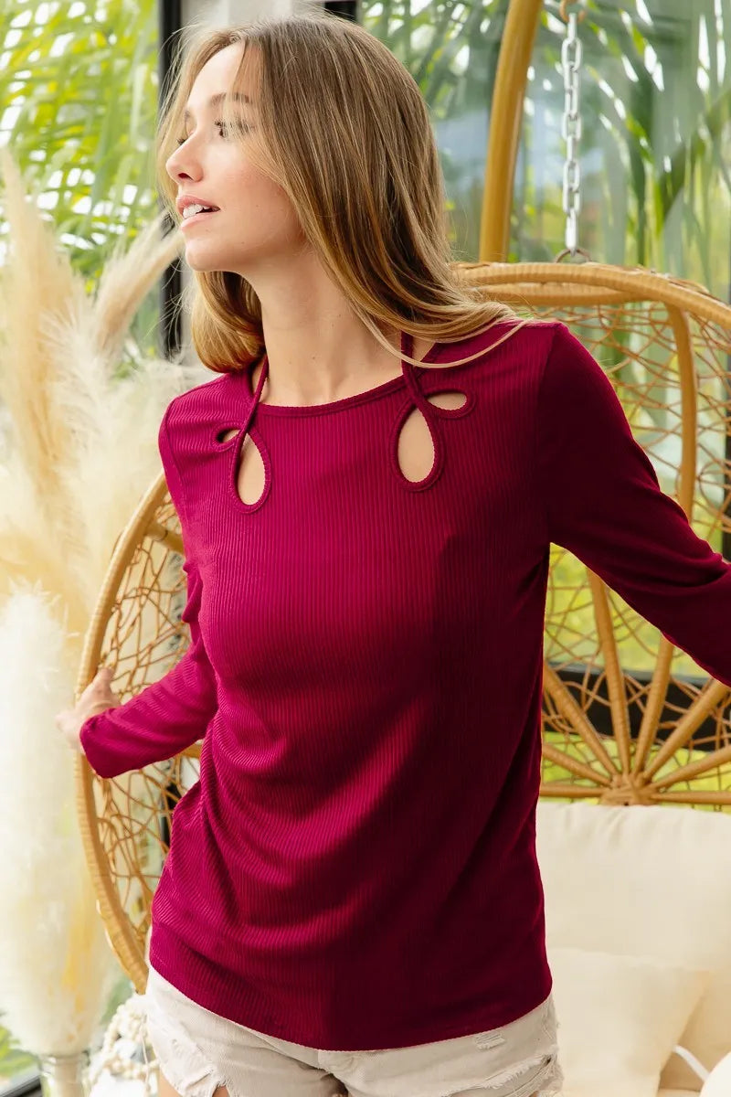 BiBi rib knit top with cut-out details and tied neck, trendy fashion piece from Trendsi, showcasing its stylish design and fit.