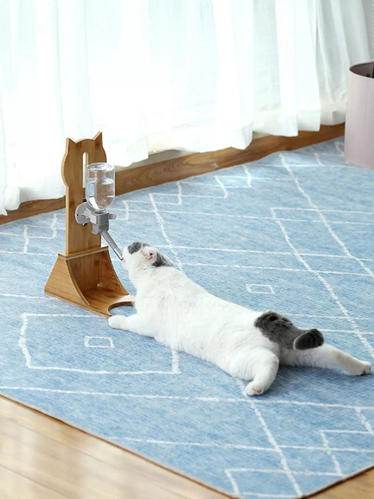 Wooden pet water dispenser by Trendsi with a natural wood finish and a clear water reservoir for pets.