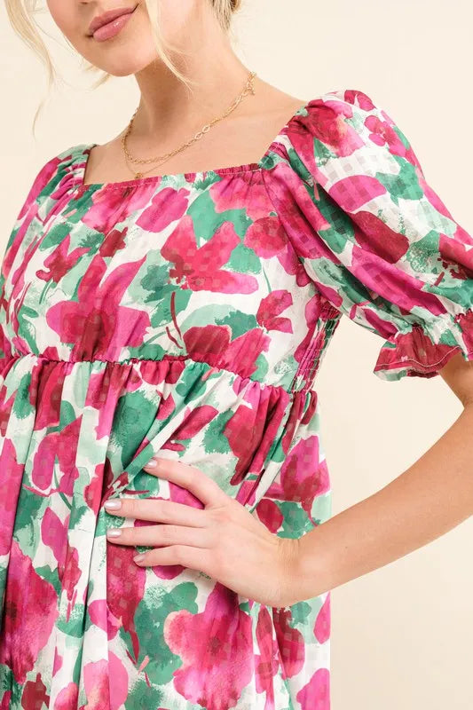 Smocked floral ruffle mini dress with short sleeves from Trendsi, featuring a feminine, flowy design and vibrant floral pattern.