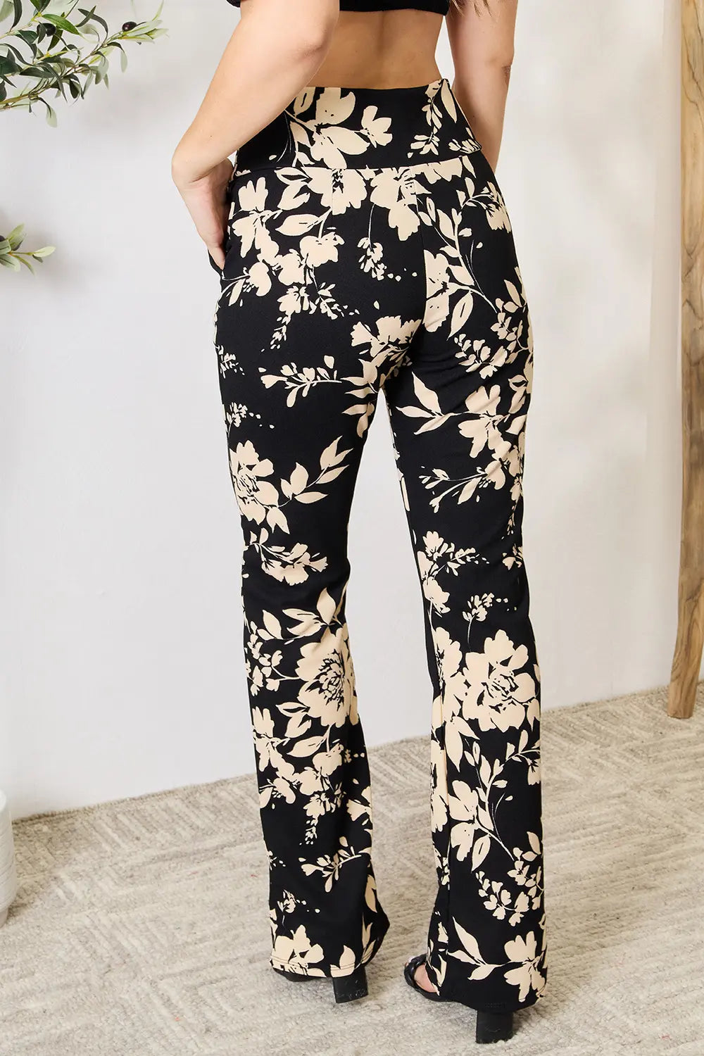 Heimish high waist floral flare pants in plus size with a full-length view, showcasing their vibrant floral pattern and wide-leg design.