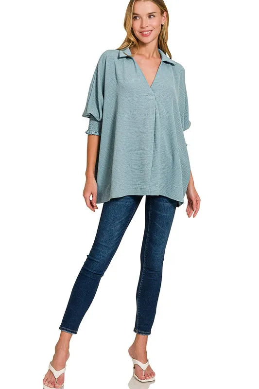 Zenana airflow collar tee with smocked sleeve band, casual women's top featuring breathable fabric and relaxed fit.