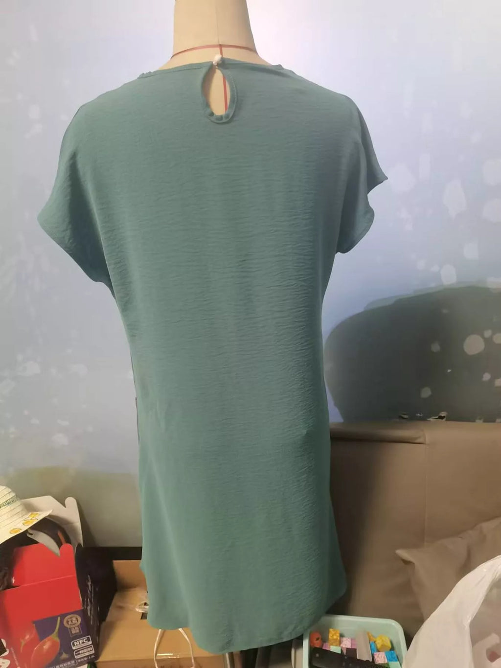Loose fit T-shirt dress with pockets by Trendsi, featuring a casual style, soft fabric, and a relaxed silhouette.