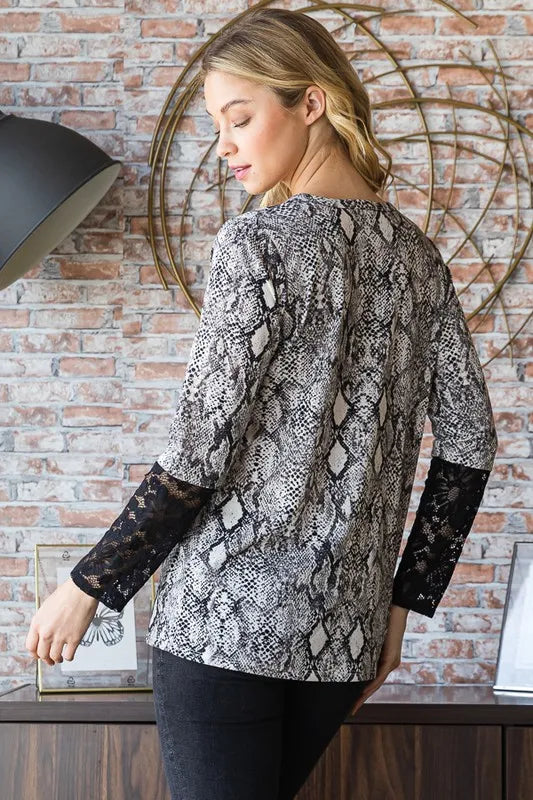 Heimish full size snakeskin print round neck lace contrast top showcasing snakeskin pattern and lace details on a stylish women's blouse