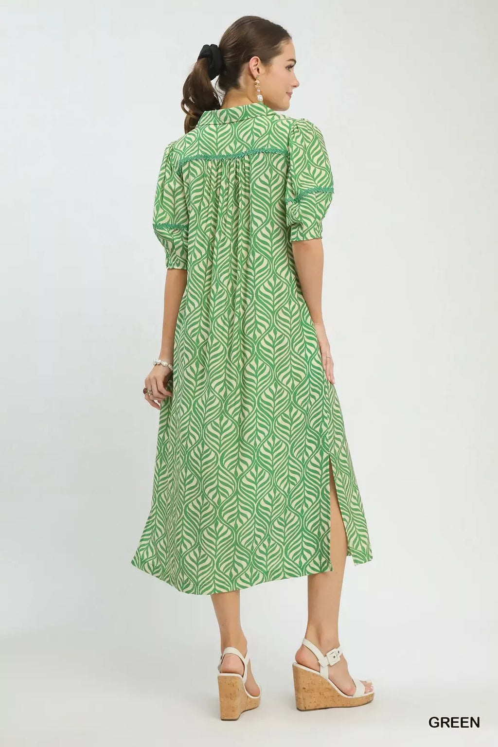 Umgee printed puff sleeve midi dress with pockets, featuring a flowy design and floral pattern, on a neutral background.