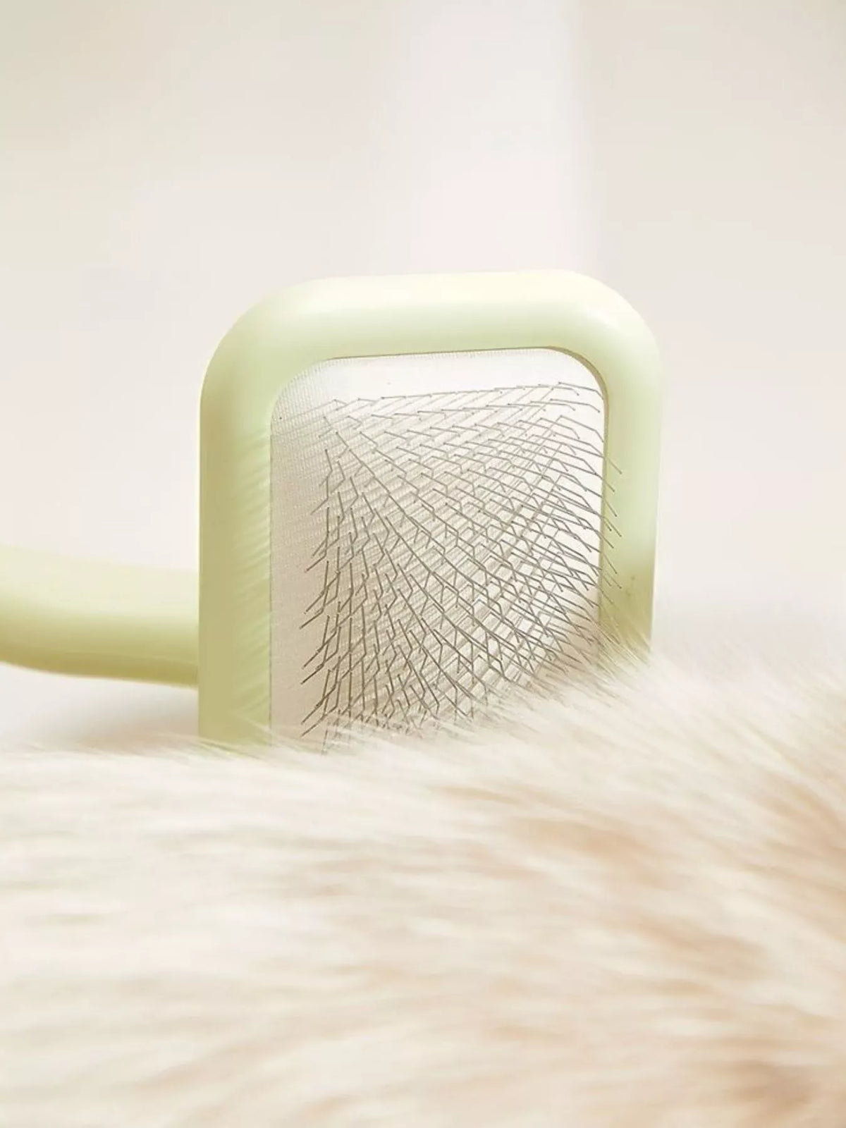 Gentle pet hair remover slicker brush by Trendsi for removing loose fur and tangles from cats and dogs' coats.