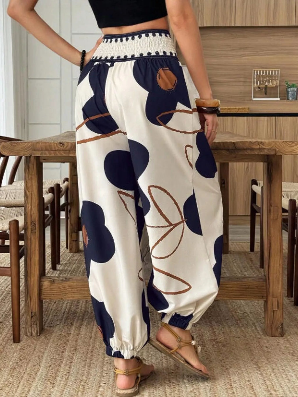 Floral print wide-leg pants from Trendsi featuring a flowy, lightweight fabric and vibrant floral design.