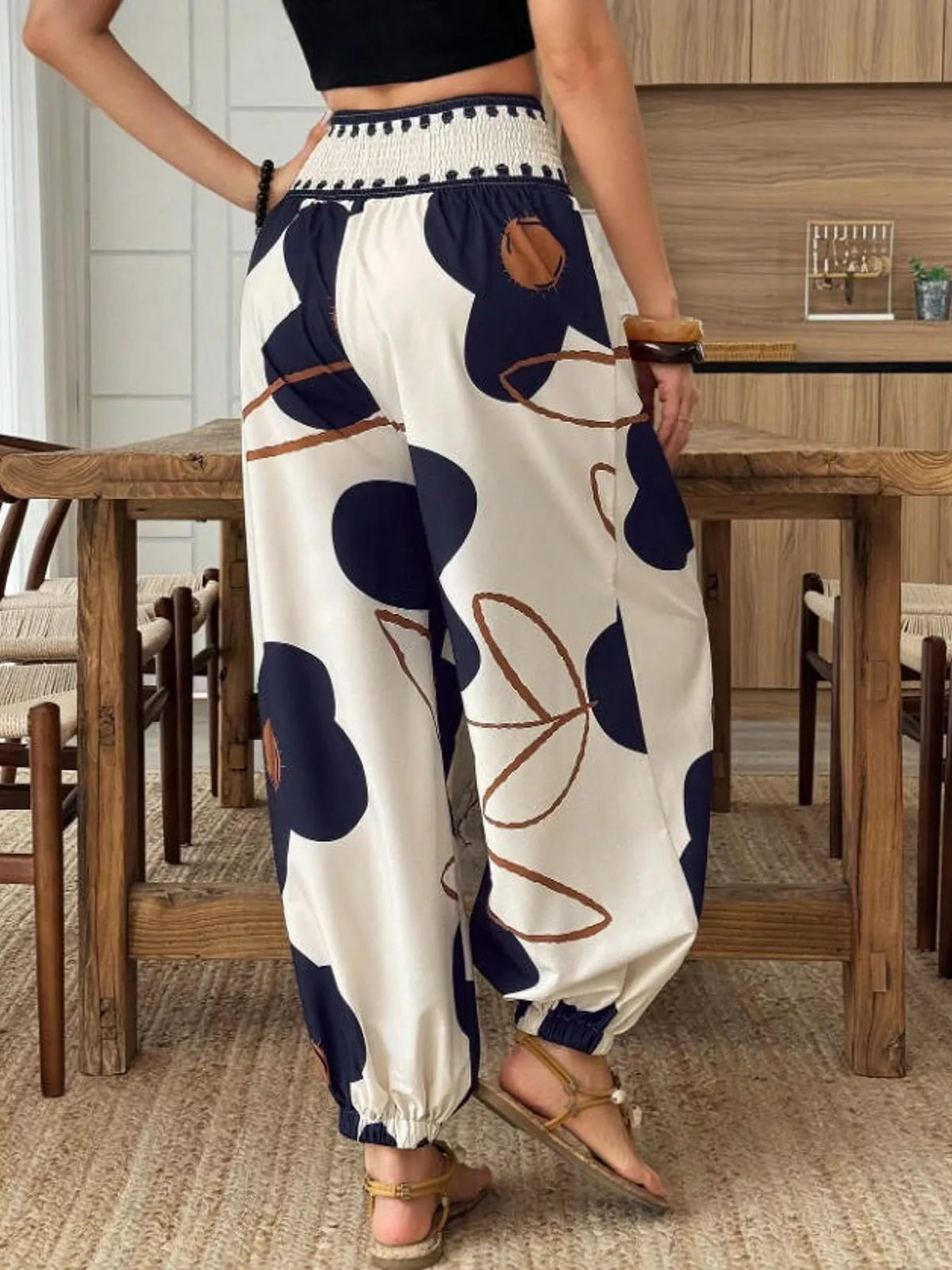 Floral print wide-leg pants from Trendsi featuring a flowy, lightweight fabric and vibrant floral design.