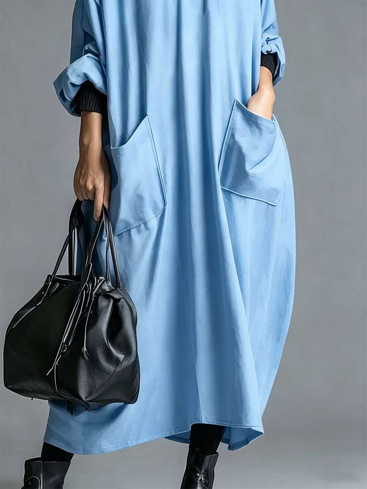 Plus size loose-fit mock neck midi dress with pockets from Trendsi, featuring a comfortable, stylish full-length design.