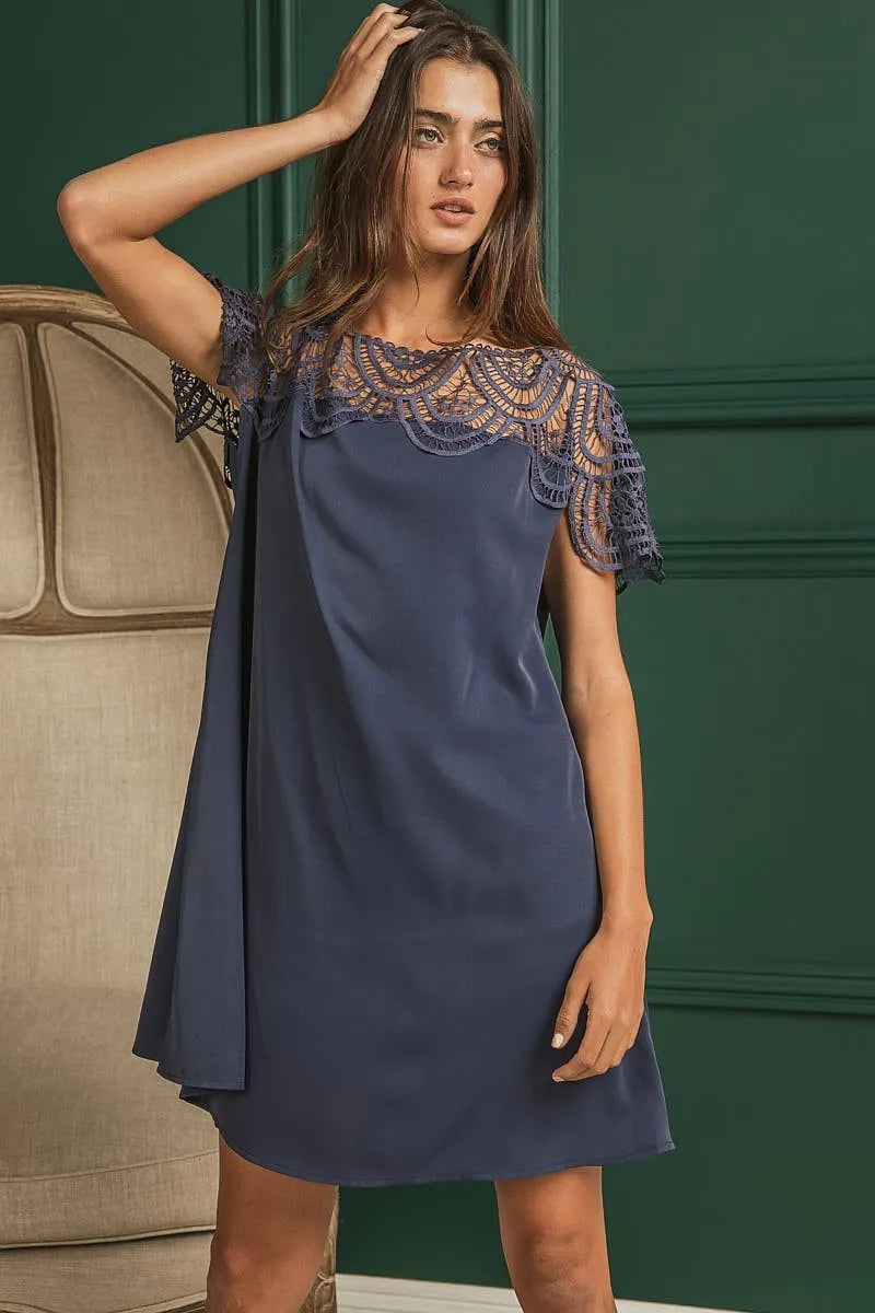 Crochet lace yoke detailed wrinkled dress by Trendsi featuring intricate lace accents and a relaxed, textured fabric.
