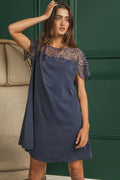 Crochet lace yoke detailed wrinkled dress by Trendsi featuring intricate lace accents and a relaxed, textured fabric.