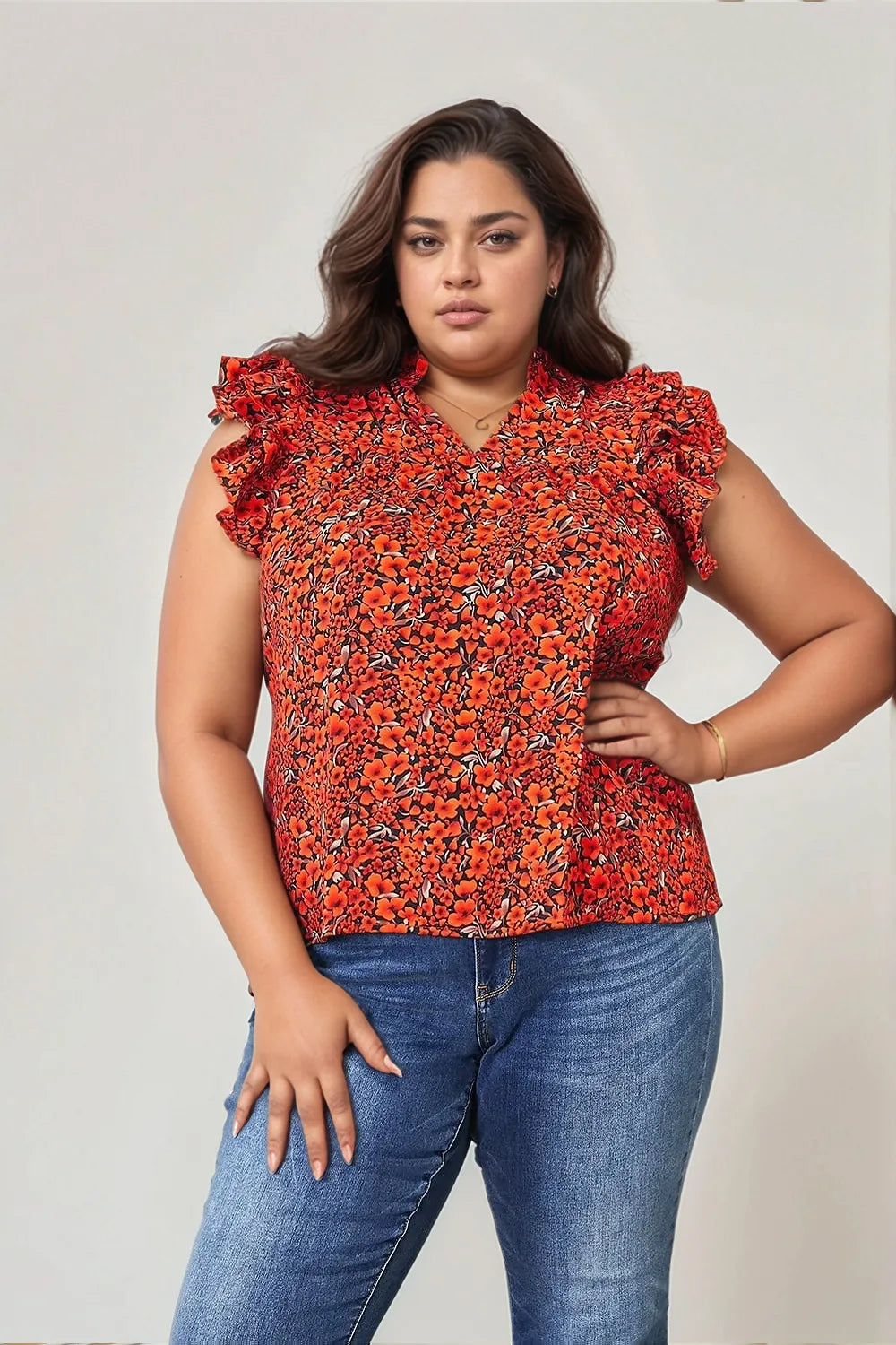 Floral flutter sleeve blouse with notched neck from Trendsi, featuring a feminine design and vibrant floral pattern.