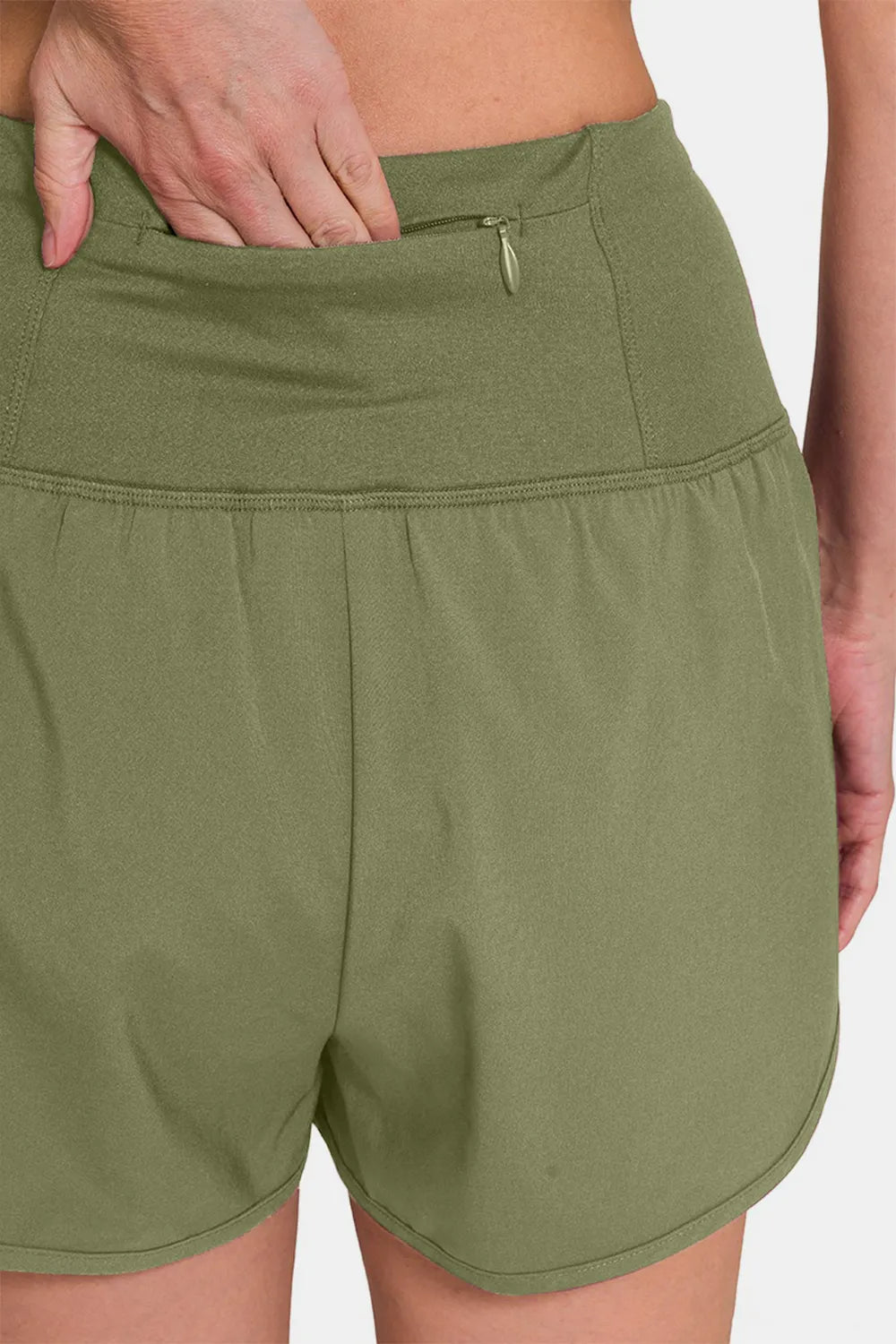 Zenana high-waisted active shorts with zippered back pocket and side pockets, designed for workout and casual wear.