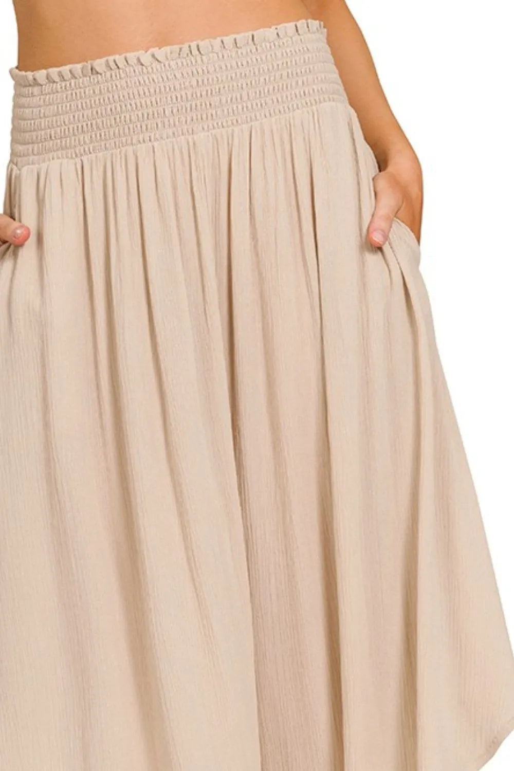 Woven crinkle maxi skirt by Trendsi with smocked waist, pockets, and flowing design, perfect for casual or boho style.