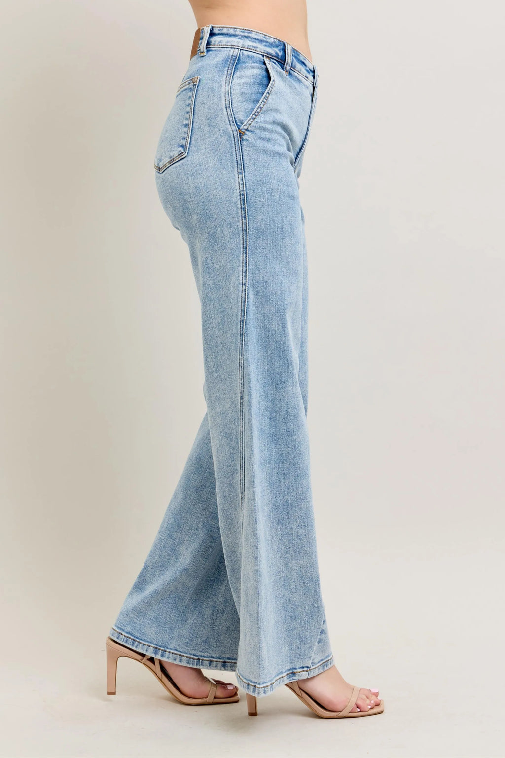 Plus size Judy Blue high waist wide leg jeans with skewed inseam, showcasing the relaxed fit and stylish silhouette.