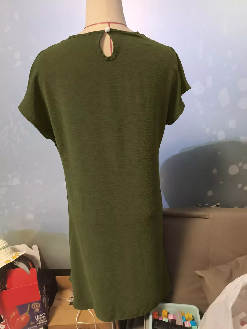 Loose fit T-shirt dress with pockets from Trendsi, shown in a casual style and soft fabric, perfect for everyday wear.
